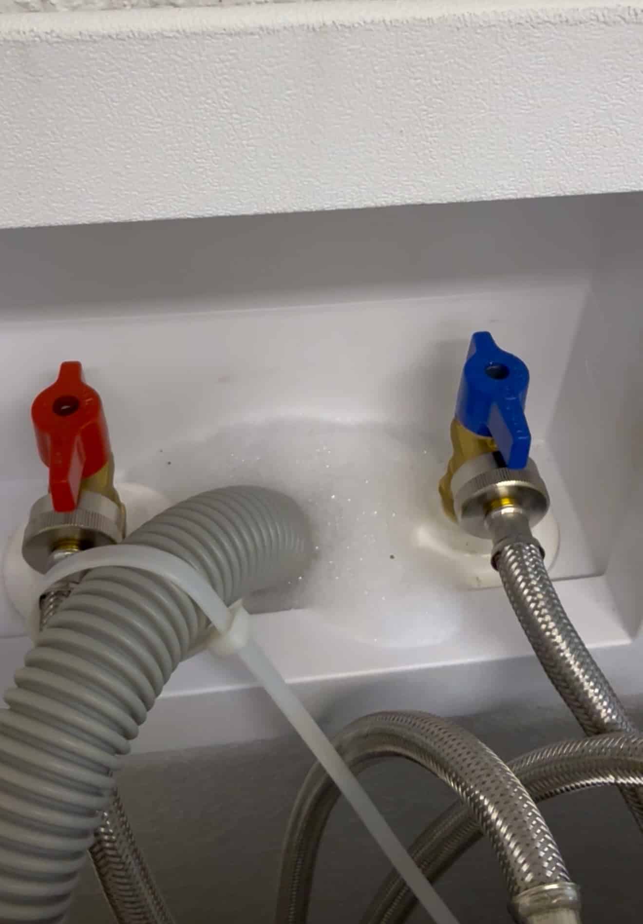 Bubbly detergent rising up front laundry drain