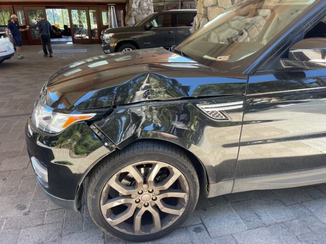The True Benefit Of Driving A Cheap Old Car - bashed Range Rover sport after parking in valet