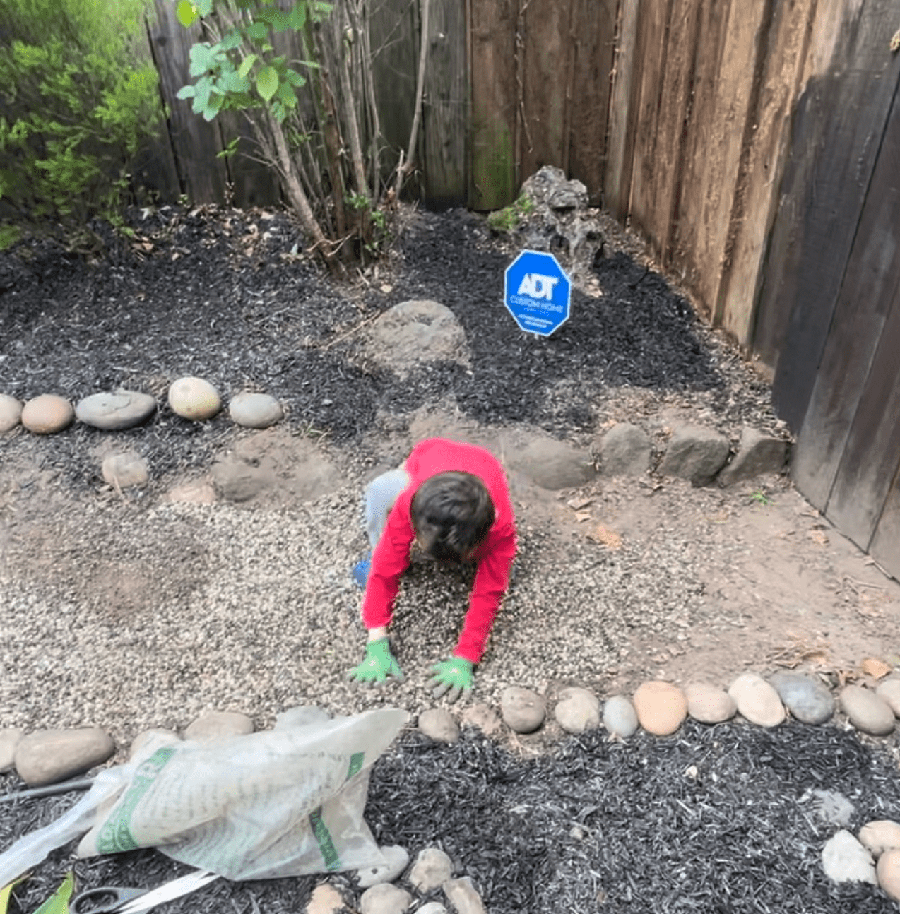 Landscaping Step #5: Spread the mulch and rocks.